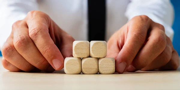 Two blank wooden dices on top of three others — Stock Photo, Image