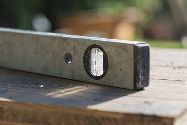 Closeup View Label Tool Lying Wooden Board Lit Sun — Stock Photo, Image