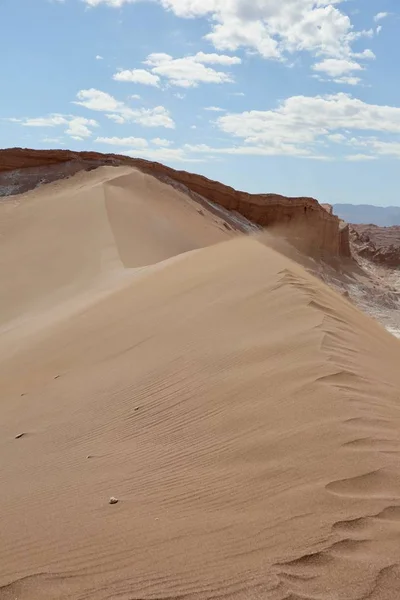 Vertical view of a giant wind-swept sand dune in Chile's Atacama Desert