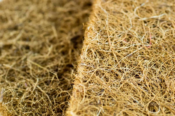 Matras met kokos vezel. Kokosnoot kokos. Geraspte Cocos schil voor de productie van matrassen. textuur, natuurlijke achtergrond. — Stockfoto