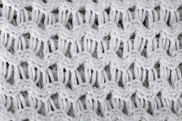 Fehér kötött gyapjú háttér. kötött meleg ruhát, a téli szövet textúra háttér — Stock Fotó