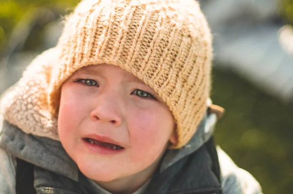 Crying little boy. Cry. Portrait of boy. Caucasian child looks at camera.