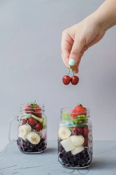 Woman Hand Fresh Sliced Fruit Jar Strawberry Cherry Bananas Blueberries — Stock Photo, Image