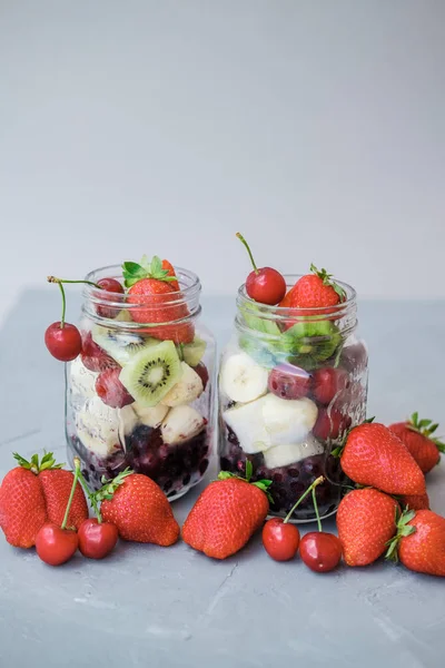 Fresh Sliced Fruit Jar Strawberry Cherry Bananas Blueberries Gray Background — Stock Photo, Image