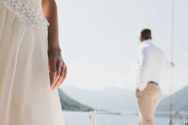 Wedding couple on the luxury yacht sailing down the sea, Montenegro