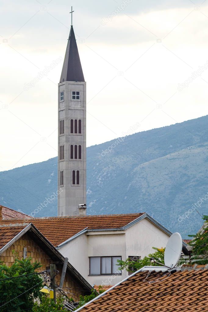 Old town houses and Peace Bell Tower (Mostarski Zvonik Mira) in mostar Bosnia and Herzegovina