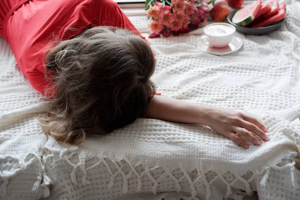 Young Blonde Woman Red Robe Flowers Lies Wide Window Background — Stock Photo, Image