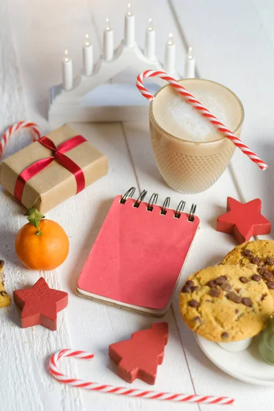 Christmas cookies with chocolate and cocoa on the background of candles.