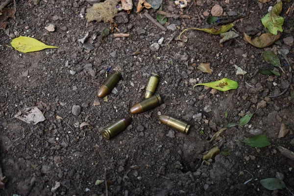 war cartridges on the street are lying around, fighting
