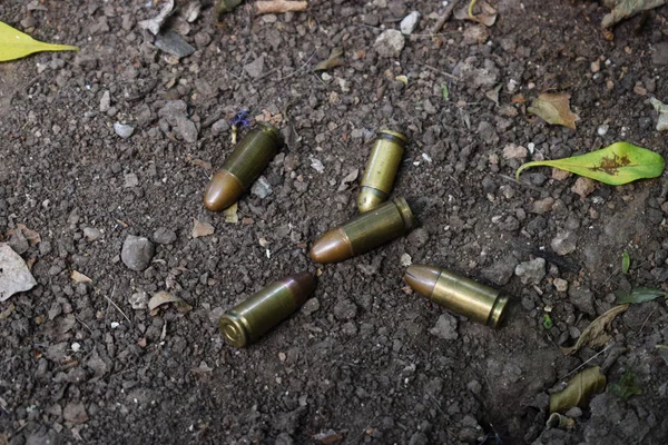 war cartridges on the street are lying around, fighting