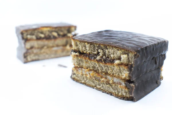 slice of chocolate cake on white background