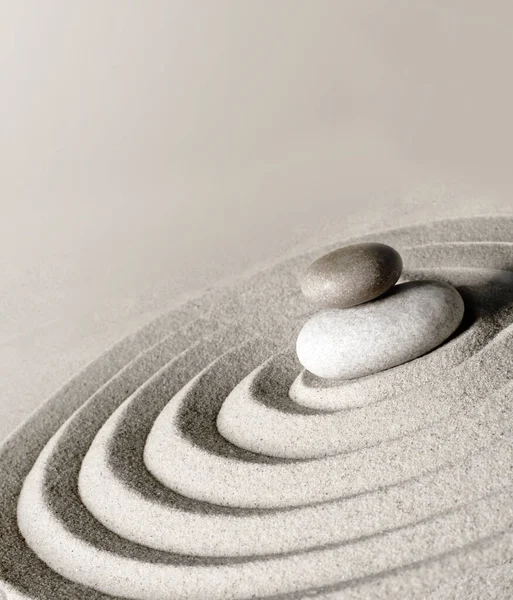 Japanese zen garden meditation stone, concentration and relaxation sand and rock for harmony and balance.