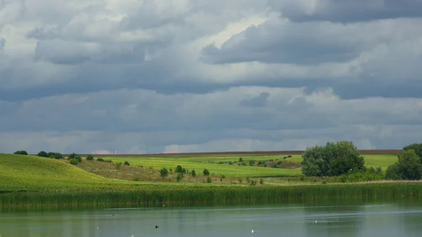 Summer landscape with hills and lake.  When traveling through Ukraine you find many beautiful landscapes with hills and lakes