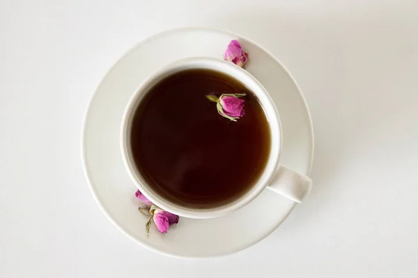 tea with roses on white