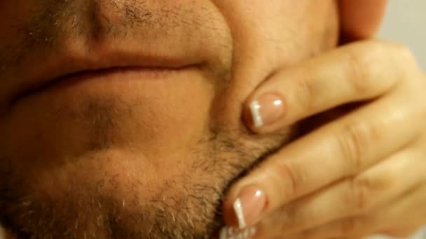Woman Hand Touches Bristle Face Man — стоковое видео