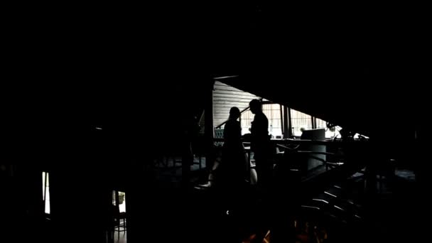 The silhouette of the newlyweds in the attic — Stock Video