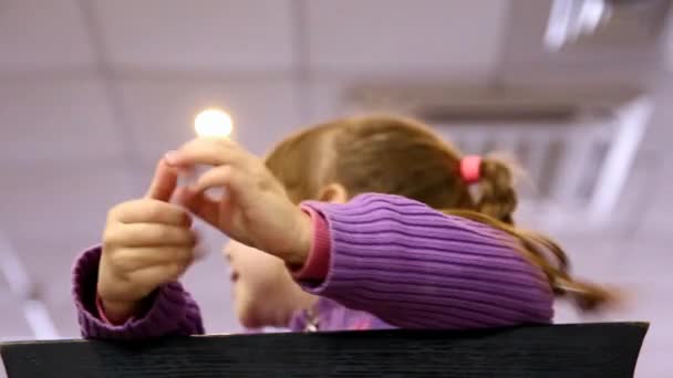 Little Girl Looks Out Chair Hides — Stock Video