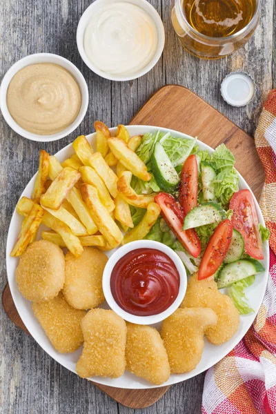 Lunch Chicken Nuggets French Fries Fresh Salad Beer Top View — Stock Photo, Image