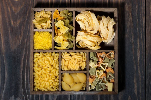 Assortment Dry Pasta Wooden Box Top View Horizontal — Stock Photo, Image