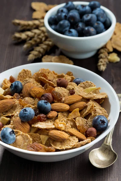 Cereal Flakes Blueberries Nuts Dark Wooden Table Closeup Vertical — Stock Photo, Image