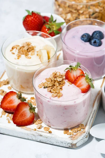 sweet yogurts with fruit and berries for a delicious breakfast, top view