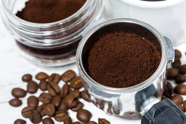 holder with aroma ground coffee on table, top view closeup