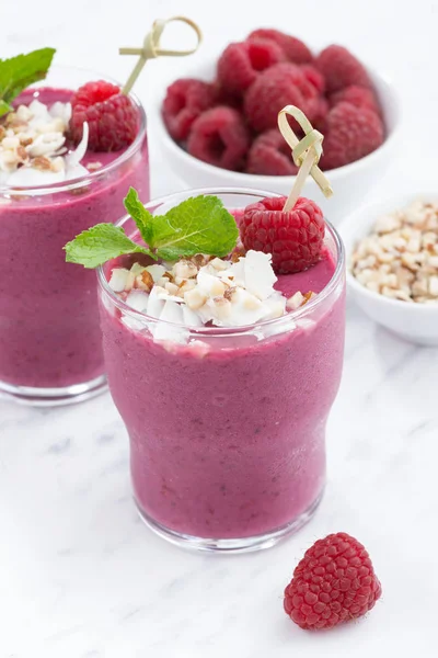 Fresh berry smoothies with nuts, closeup vertical — Stock Photo, Image