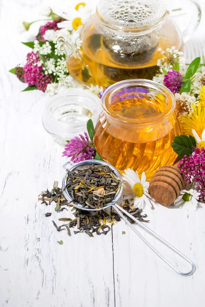 Fresh flower honey, tea and ingredients on white background, ver — Stock Photo, Image