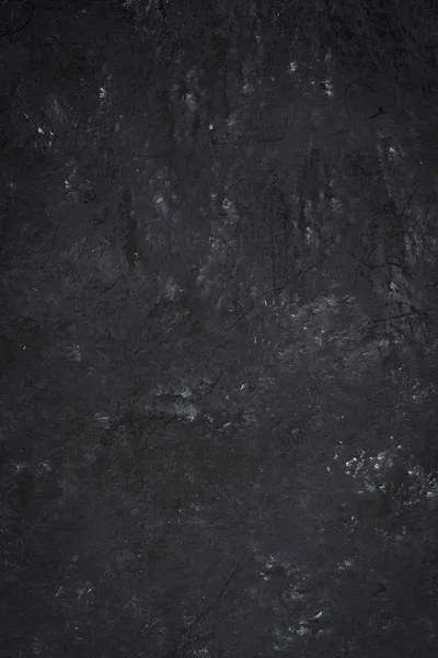 abstract black stone background, top view, vertical
