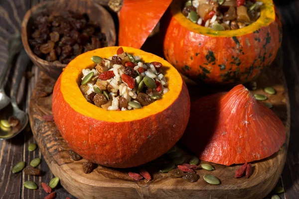 Rice with dried fruit in a pumpkin — Stock Photo, Image