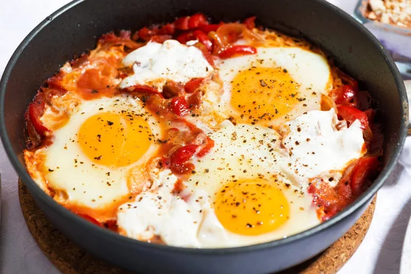 Shakshuka fried eggs in a pan — Stock Photo, Image