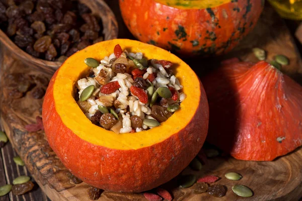 Sweet rice with dried fruit in a pumpkin, top view — Stock Photo, Image