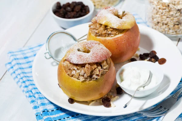 Healthy breakfast. oatmeal with raisins baked in apple, top view — Stock Photo, Image