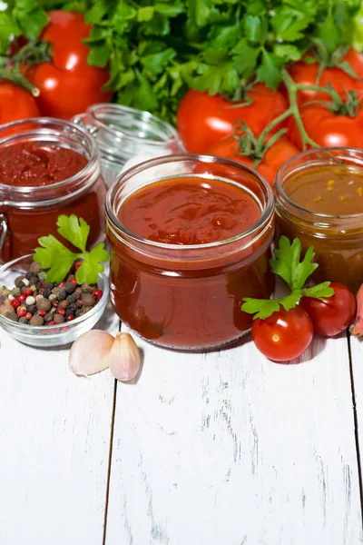 Assortment of tomato sauces and ingredients on white background — Stock Photo, Image