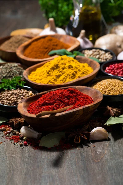 Assortment Oriental Spices Wooden Table Vertical — Stock Photo, Image