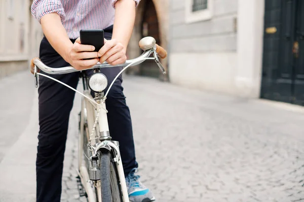 Staying in touch with his clients , mobile communication and bicycle app