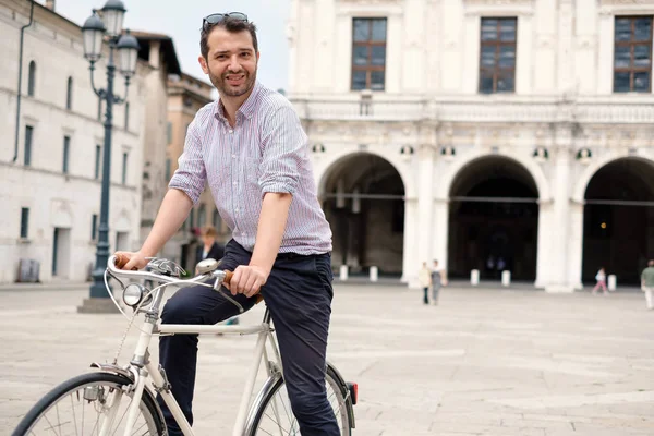 Handsome man on his bike in the city