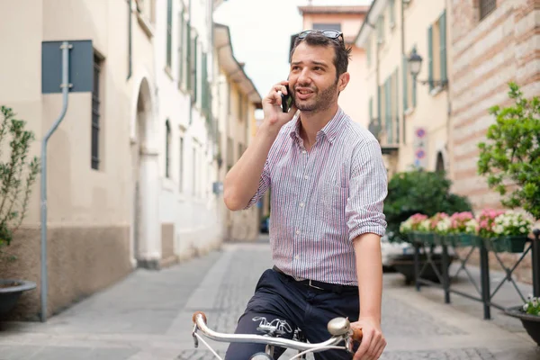 Staying in touch with his clients , man talking on smartphone