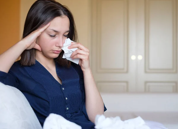 Sad young woman feeling lonely crying about relationship problems