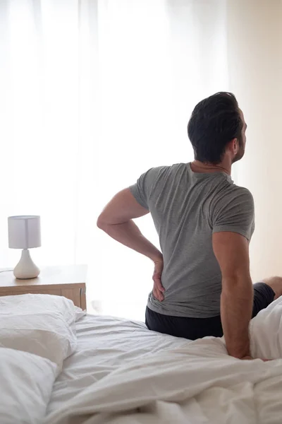 Hombre Sintiendo Dolor Espalda Después Dormir Cama —  Fotos de Stock