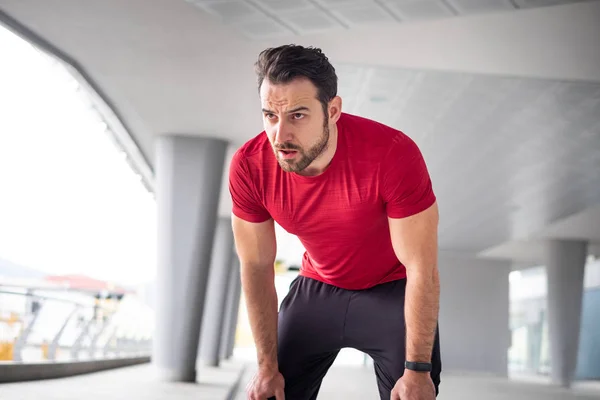 Tired athlete resting after big training effort