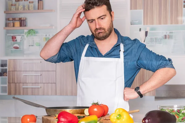 Sad and frustrated man with problem in the kitchen
