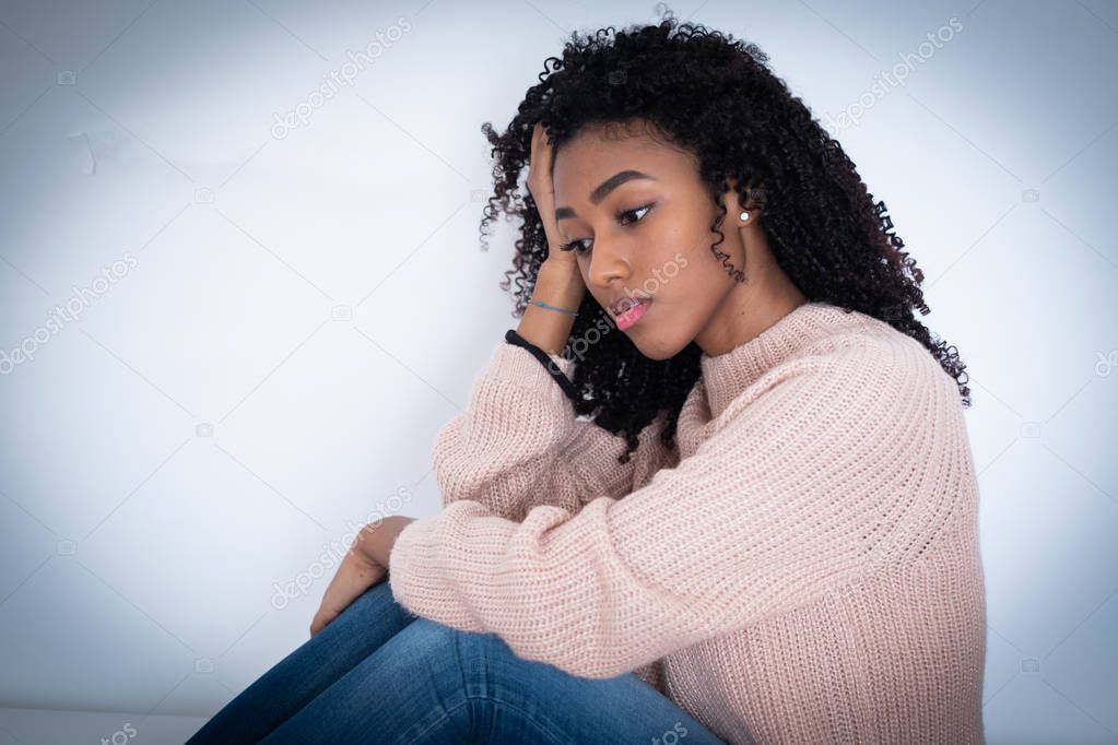 Young girl in trouble feeling sad and depressed