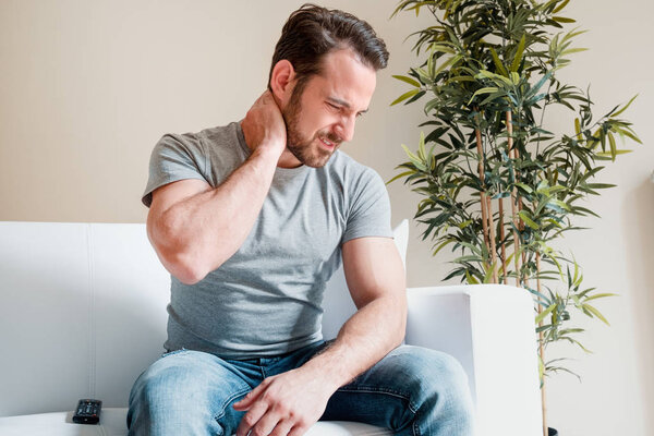 Man portrait feeling bad for painful neck ache