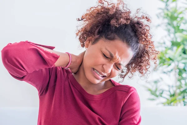 Neck pain. Painful woman holds with hand her neck — Stock Photo, Image