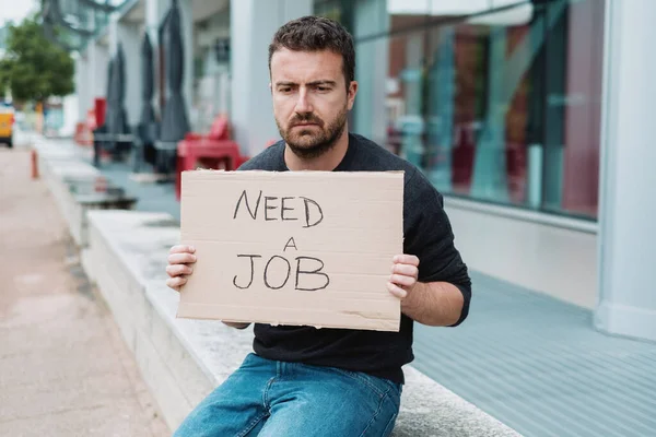 Jobless guy looking for a job and begging in the streets