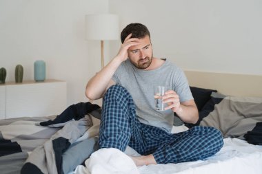 Man with sleeping problem wake up feeling tiredness clipart