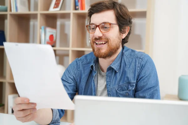 Happy Guy Working Home Holding Job Document — Stock fotografie