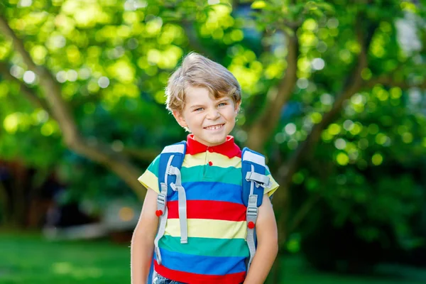 Little kid boy with school satchel on first day to school — Stock Photo, Image