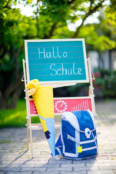 School beginning concept. Satchel and schoolbag, backpack, desk and traditional German school cone with gifts called Schultuete in Germany — Stock Photo, Image